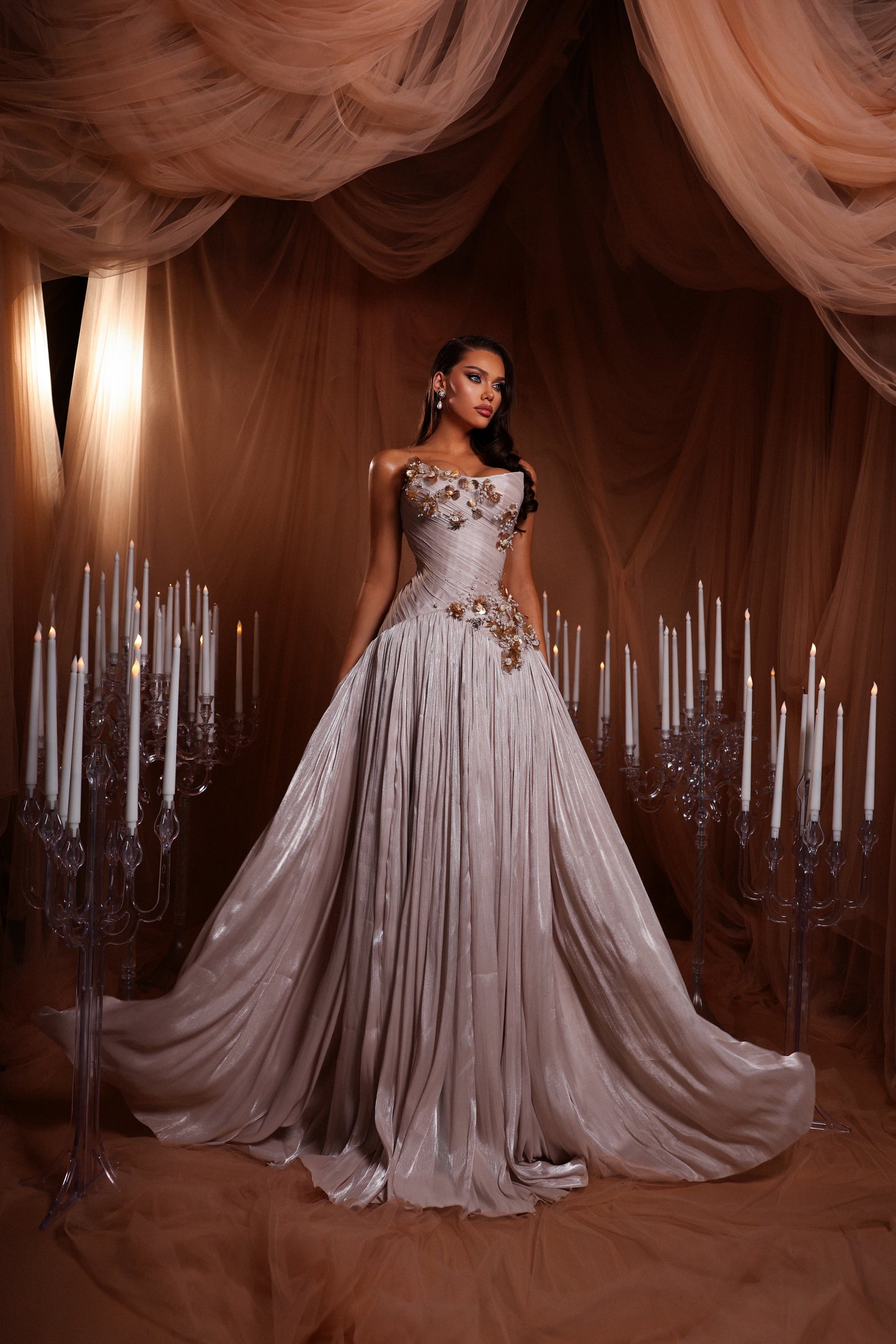 Draped gown with golden appliqué details