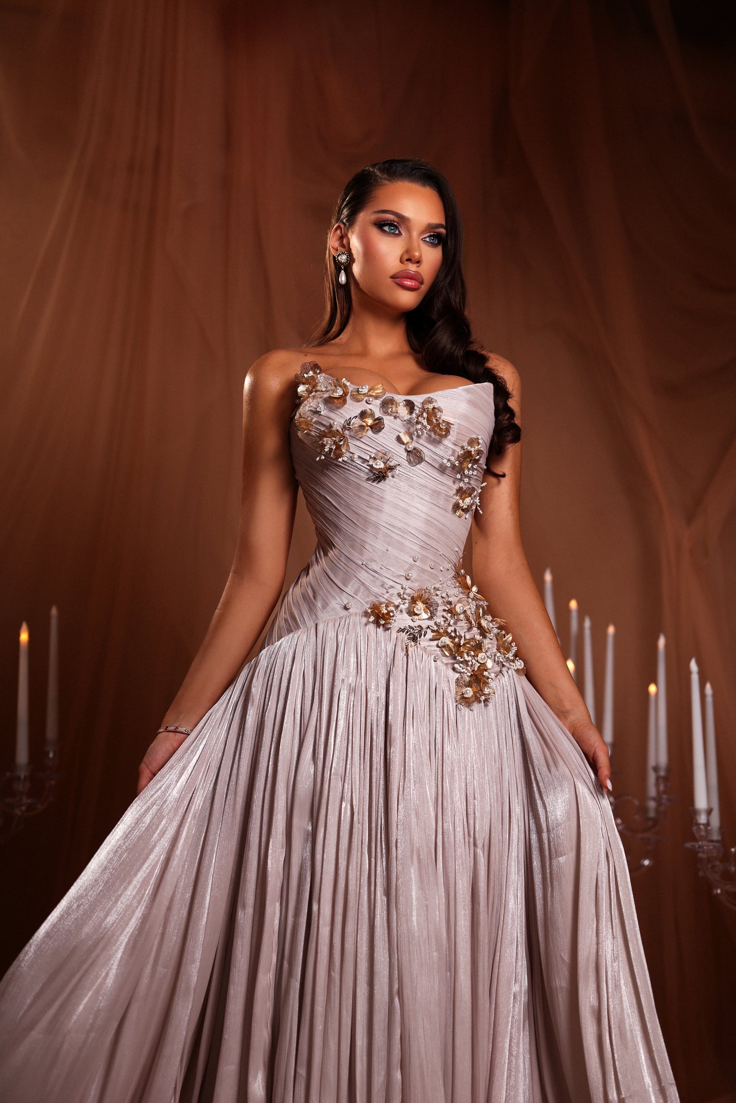 Draped gown with golden appliqué details